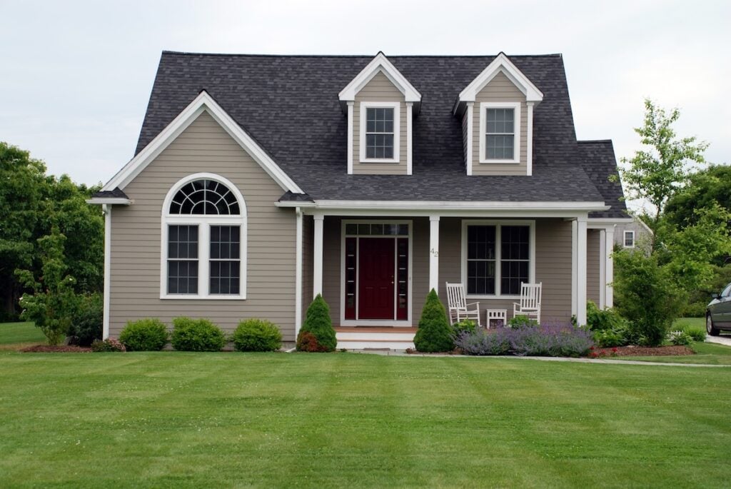 Brown house siding with black asphalt roof