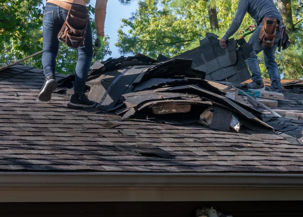 tearing off sotrm damage shingles